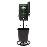 A portable ice maker in green and black, positioned on a stand, suitable for home or outdoor use.